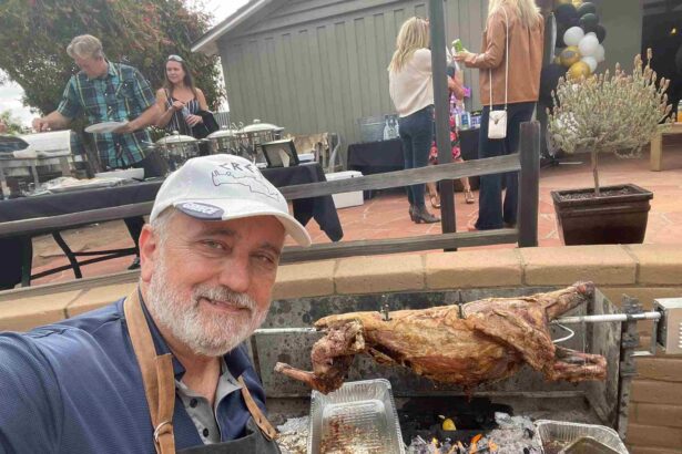 bob cooking lamb oon a spit